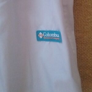 Columbia White Pants With Salmon And teal Accents.